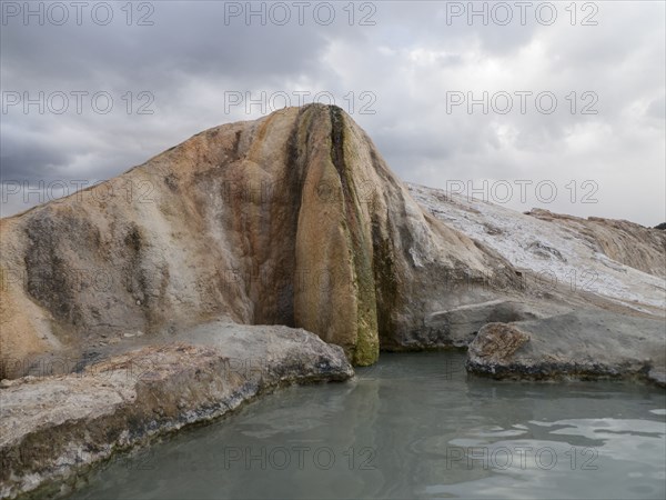 Rock formation over hot spring