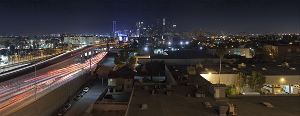 Aerial view of traffic on highway in Los Angeles cityscape