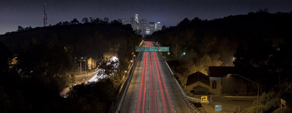 Aerial view of traffic on highway in Los Angeles cityscape