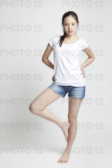 Chinese woman standing on one leg