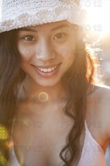 Smiling Chinese woman in hat
