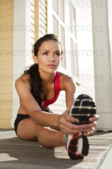 Woman warming up before exercise