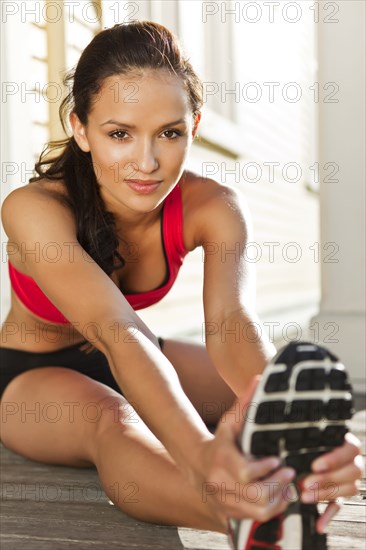 Woman warming up before exercise