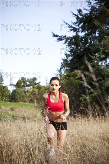 Jogger running through field