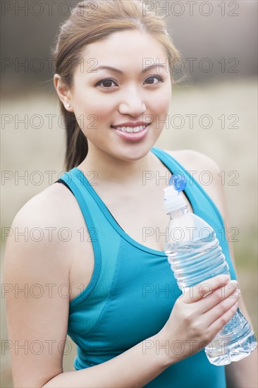 Asian woman drinking water