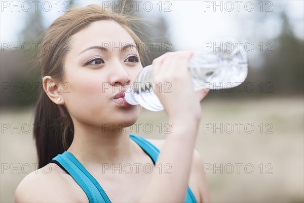 Asian woman drinking water