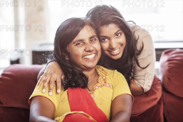 Smiling Indian mother and daughter