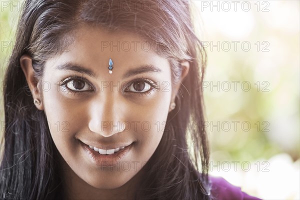 Indian woman with jewel on forehead