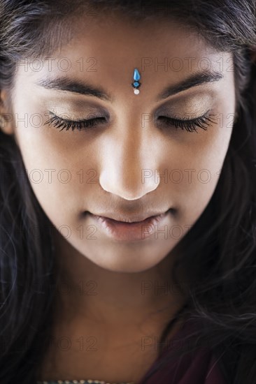 Indian woman with jewel on forehead