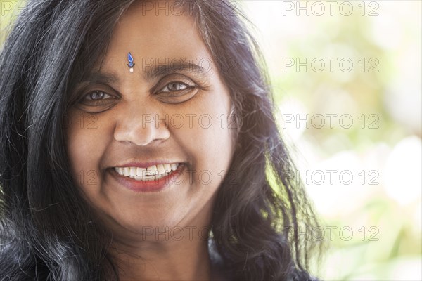 Indian woman with jewel on forehead