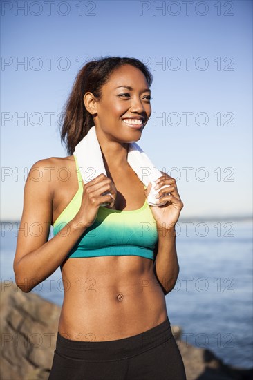 Mixed race woman resting during run