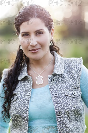 Hispanic woman standing outdoors