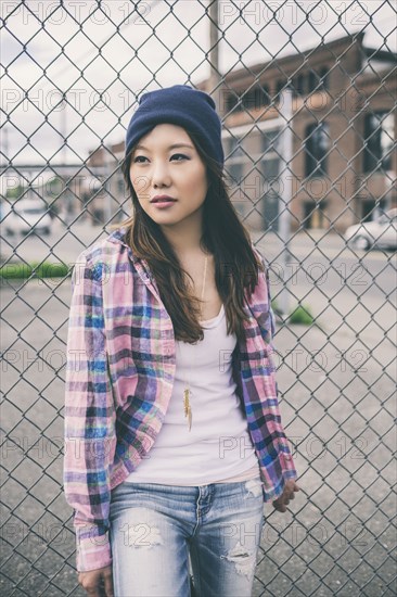 Korean woman standing on city street