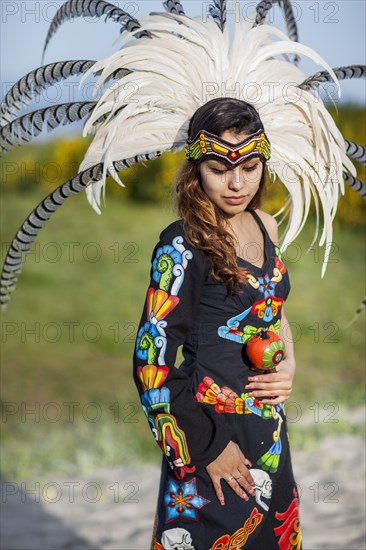 Native American woman wearing traditional headdress