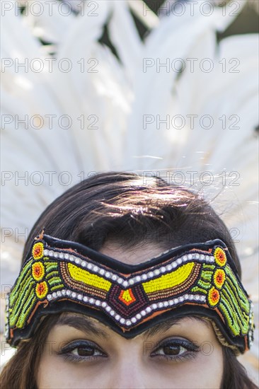 Native American woman wearing traditional headdress