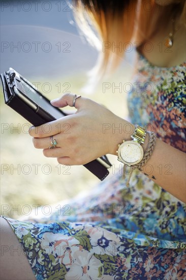 Chinese woman using digital tablet