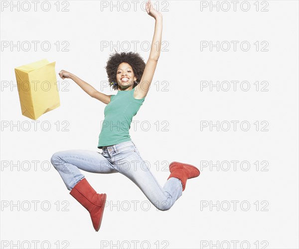 Young woman jumping for joy