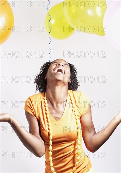 African woman laughing at party