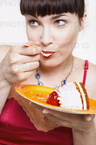 Close up of woman eating cake