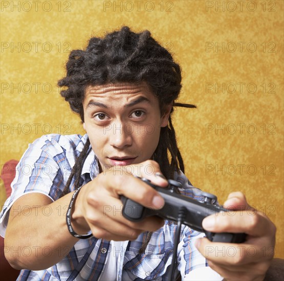 Close up Hispanic man playing video games