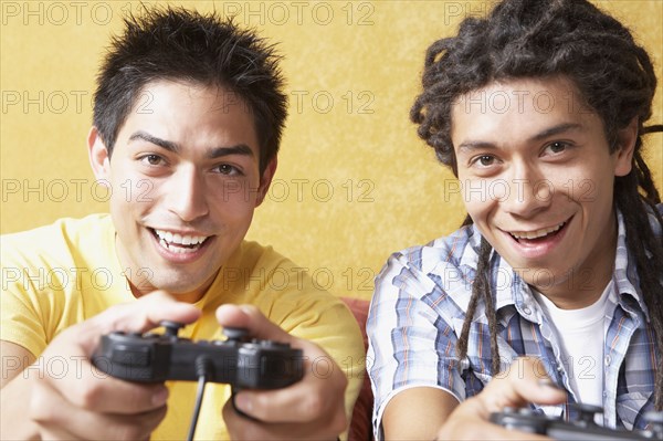 Two Hispanic men playing video games