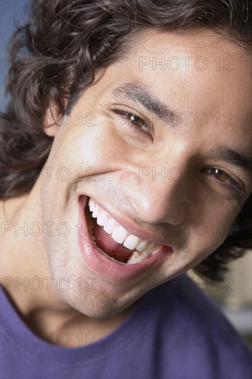 Close up of Hispanic man laughing