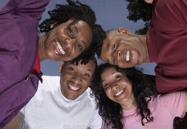 Multi-ethnic friends in huddle