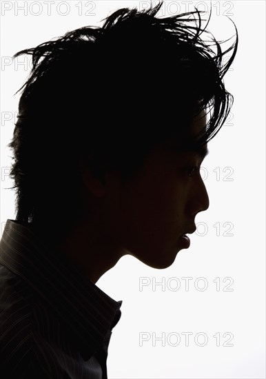 Silhouette profile of Asian man