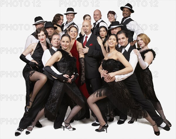 Multi-ethnic people posing in tango outfits