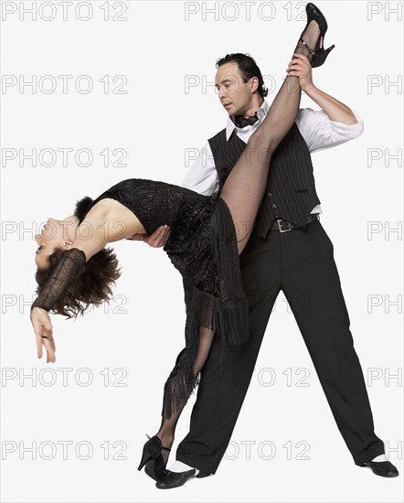 Multi-ethnic couple tango dancing