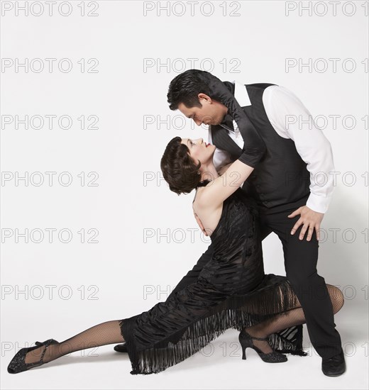 Multi-ethnic couple tango dancing