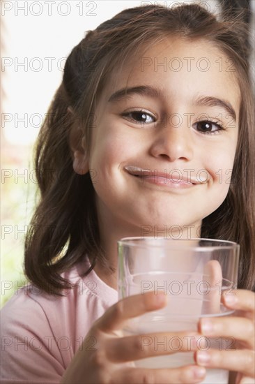 Middle Eastern girl drinking milk