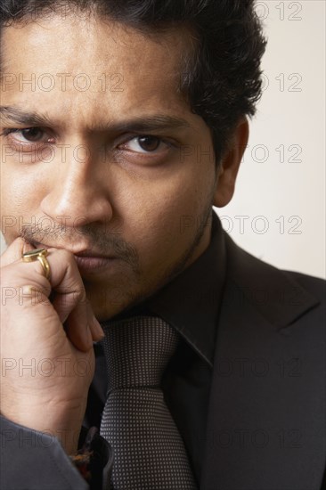 Indian businessman making face