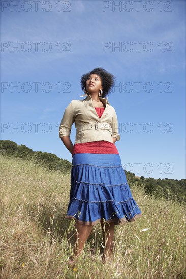 African woman standing in field