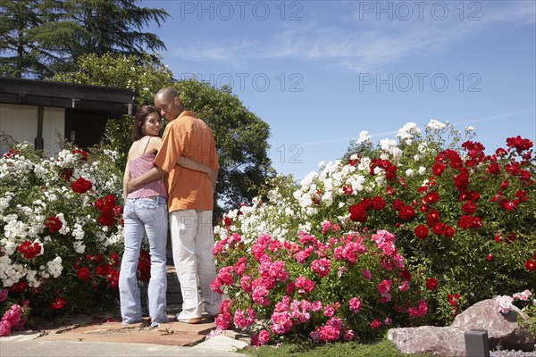 Multi-ethnic couple hugging