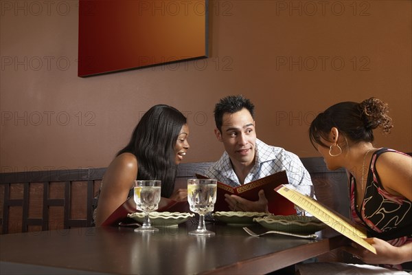 Multi-ethnic friends at restaurant