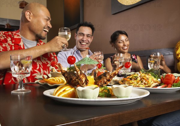 Multi-ethnic friends at restaurant