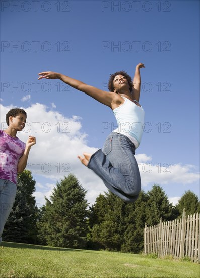 African American woman jumping