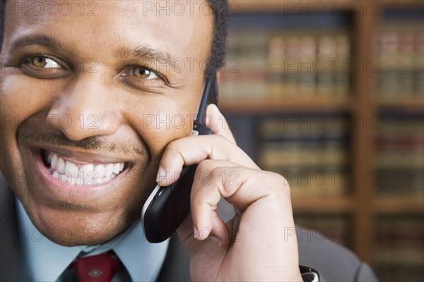 African American businessman talking on cell phone