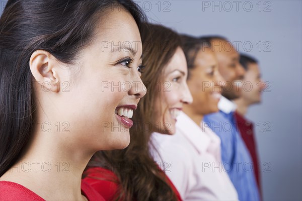 Row of multi-ethnic adults