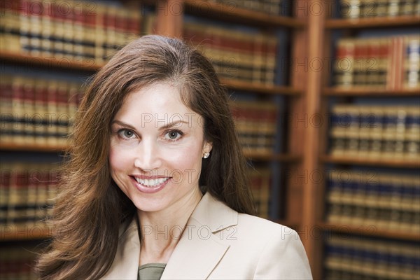 Hispanic businesswoman in library