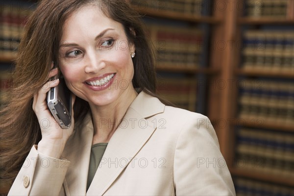 Hispanic businesswoman talking on cell phone