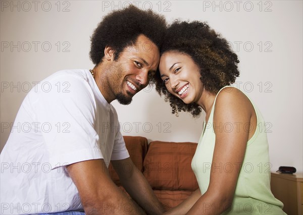 African couple touching foreheads