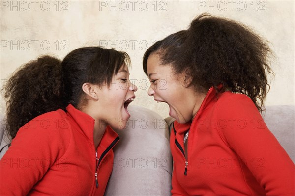 African twin sisters yelling