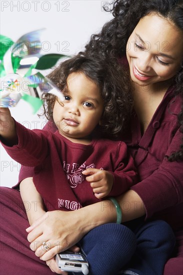 Mixed Race mother hugging son