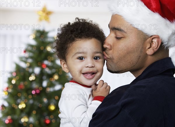 African father kissing baby