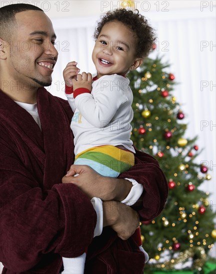 African father and baby laughing