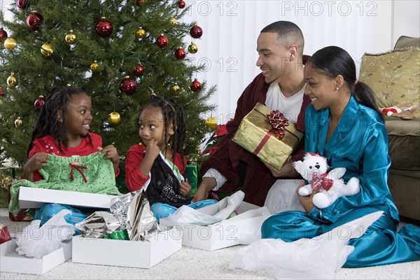 African family opening Christmas gifts