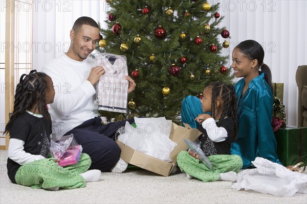 African family opening Christmas gifts