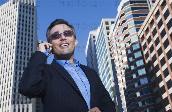 Hispanic businessman talking on cell phone